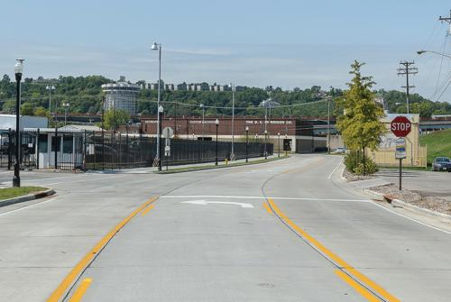 Corridor Improvements - New fenced IRS parking lot access (left), floodwall pump house (right) - Covington, KY